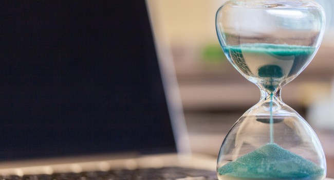 stock-photo-hourglass-on-laptop-computer